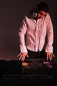 PictureIndia - Young man working as DJ