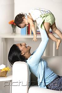 PictureIndia - woman holding baby in the air
