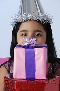 PictureIndia - Little girl holding birthday presents