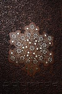 PictureIndia - Close up of wood carving on Indian table.