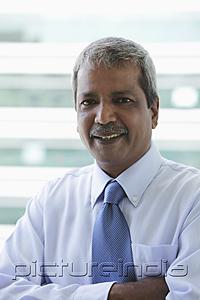 PictureIndia - Head shot of Indian business man