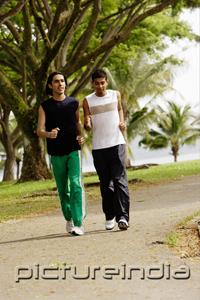PictureIndia - Young men jogging in park