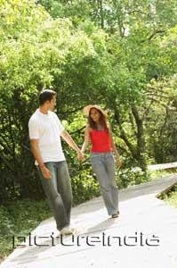 PictureIndia - Couple in park, holding hands and walking
