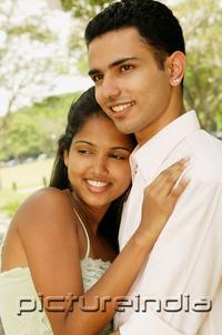 PictureIndia - Portrait of a couple, woman leaning on man's chest