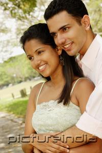 PictureIndia - Portrait of a couple, man embracing woman from behind