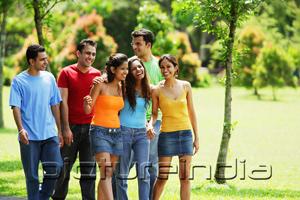 PictureIndia - Young adults, walking in park