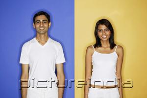 PictureIndia - Couple standing apart, looking at camera