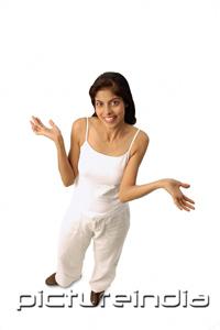 PictureIndia - Woman standing, arms open, looking at camera