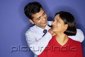 PictureIndia - Man leaning on woman's shoulder, woman turning to look at him
