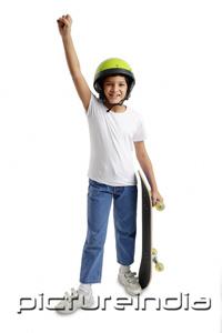 PictureIndia - Boy with helmet and skateboard, arm outstretched