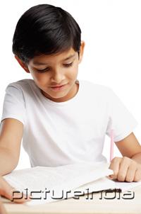 PictureIndia - Boy with book and pencil, writing