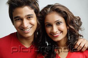 PictureIndia - Couple looking at camera, smiling