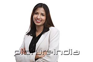 PictureIndia - Businesswoman looking at camera, arms crossed